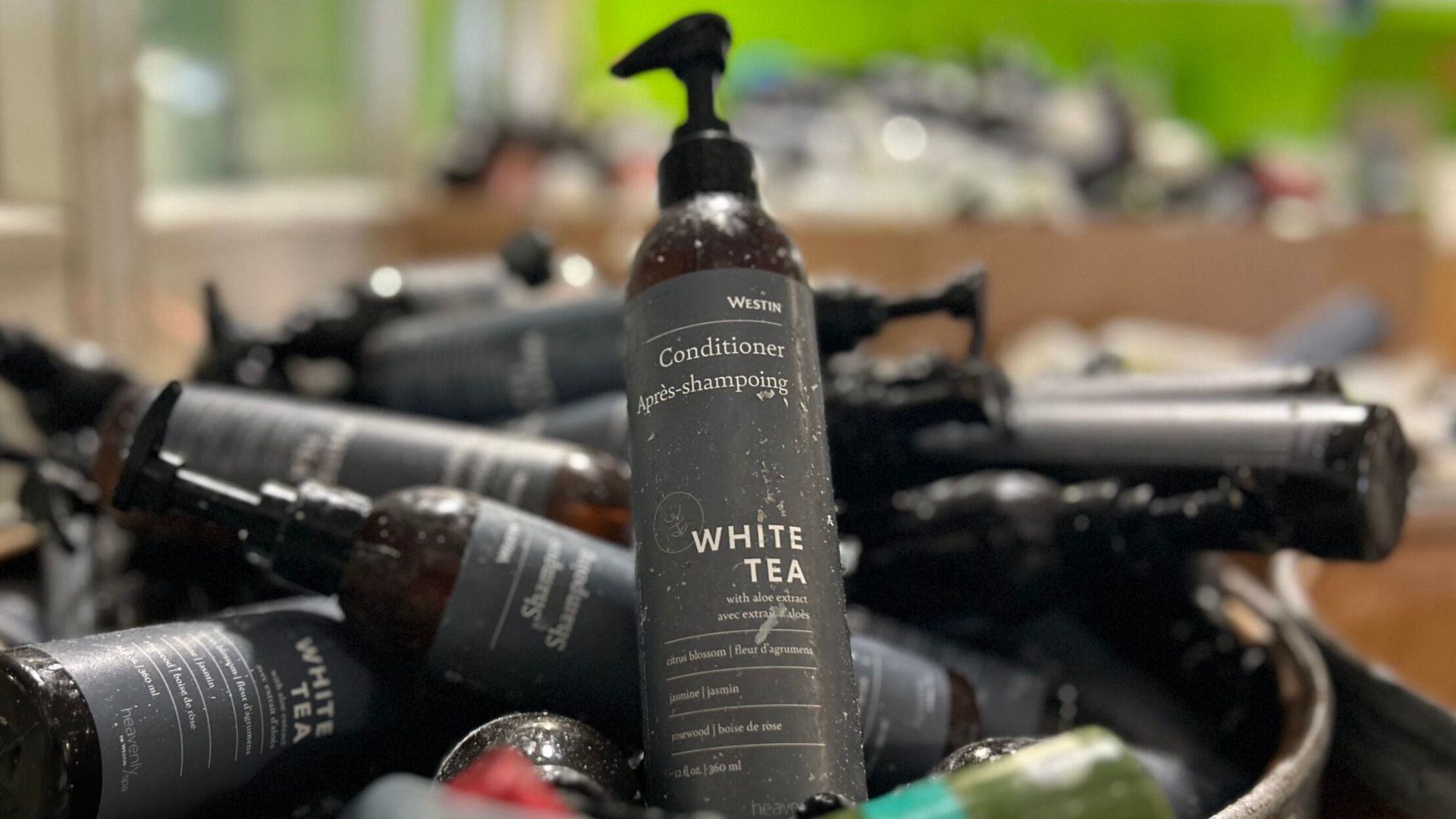 Hotel bathroom amenity bottles illustrating bathroom amenity waste and ESG reporting
